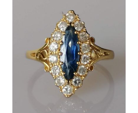 An 18ct yellow gold marquise-set sapphire and diamond ring, sapphire 13 x 5mm, the fourteen round-cut diamonds approximately 