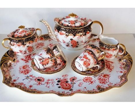 An Edwardian Royal Crown Derby tea service, pattern 2649, comprising four cups/saucers/plates, covered sugar bowl, cream jug,