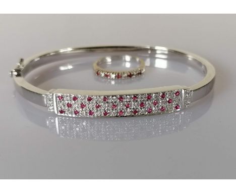 A ruby and diamond bangle on an 18ct white gold setting with matching ring; bangle/ring total diamond approximate weight 0.31