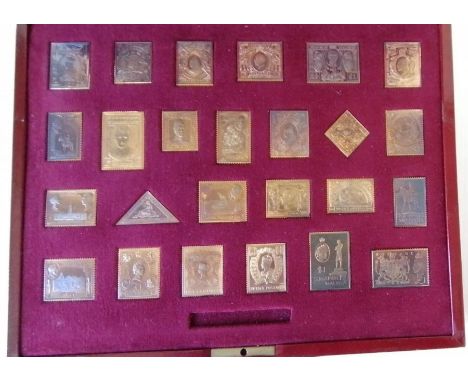 A silver gilt replica stamp proof set, 'The Empire Collection' comprising twenty-five various gold plated hallmarked silver r