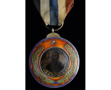 *China, Republic, Wu Pei Fu Military Marksmanship Medal, circa 1925, in silver-gilt and enamels, with tintype portrait of the