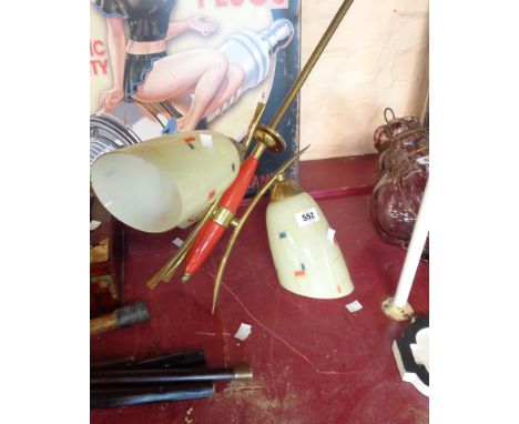 A 1960`s retro red torpedo shaped light fitting with decorated shades
