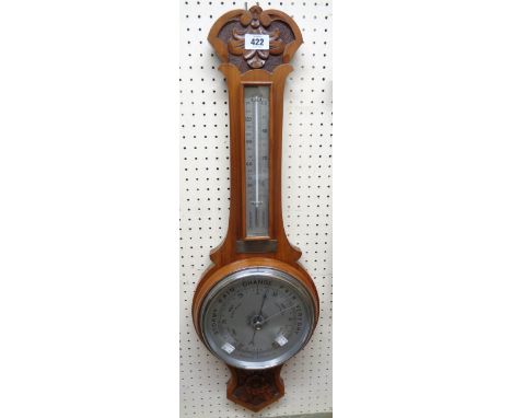 A 1930`s walnut cased banjo barometer/thermometer with printed metal dial and scale, aneroid works and bowls interest present