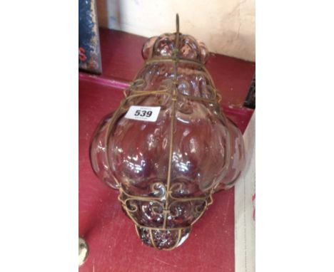 An amethyst bubble glass and wrought metal pendant lampshade