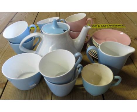 A box containing a Poole Pottery and other part china tea services