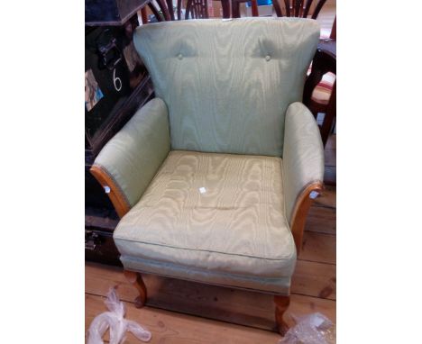 A vintage upholstered boudoir armchair with polished wood part show frame and cabriole front legs
