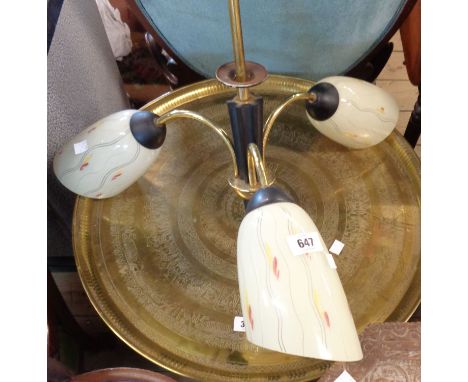A 1960`s retro black light fitting with decorative shades
