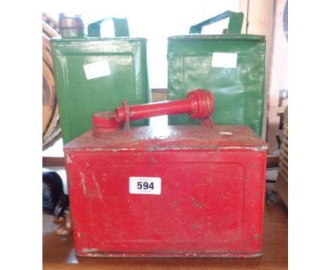A vintage Shellmex two gallon petrol can, a 1950's military issue similar, and a one gallon can - all with later paint finish