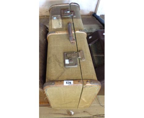 A vintage bentwood bound and weatherclad suitcase