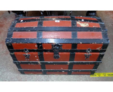 A 35" late 19th Century wood and metal bound dome top travelling trunk with remains of compartment and tray fitted interior, 