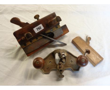 A vintage Stanley No.71 router plane, plough plane, and another 