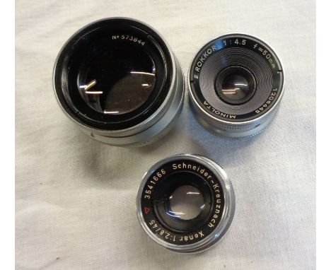Three vintage enlarger lenses including Minolta