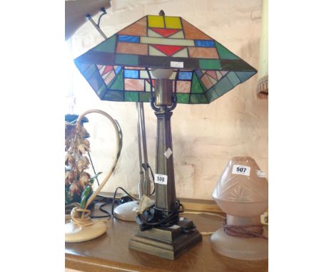 A modern table lamp with Tiffany style shade