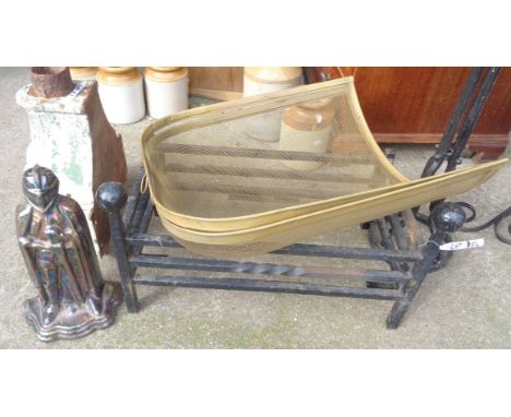 A cast iron fire grate, guards and knight pattern companion set stand - sold with a vintage Jaguar squash racquet and a later