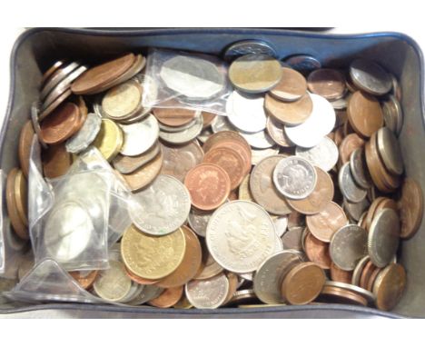 A vintage tin containing a collection of Great British and Commonwealth coinage