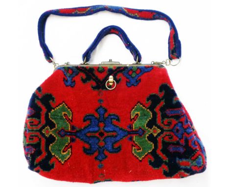 A vintage carpet bag with Gladstone action by Carpet Bags of Suffolk