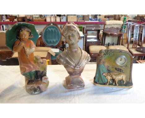 A vintage painted plaster figure of a girl with an umbrella, a figural clock with shepherdess and sheep, and an Art Nouveau t