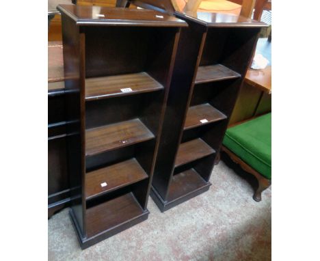 A pair of 14 3/4" reproduction mahogany four shelf open bookcases with plinth bases