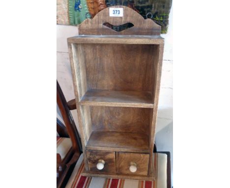 A 11" stained hardwood wall mounted spice rack with two shelves and two short drawers under