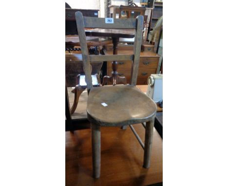 A vintage child's school chair with moulded solid elm seat and simple turned supports - stains and wear, front stretcher miss