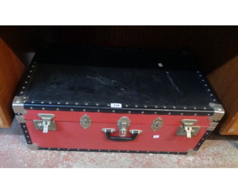 A 30" vintage black and red and metal bound travelling trunk