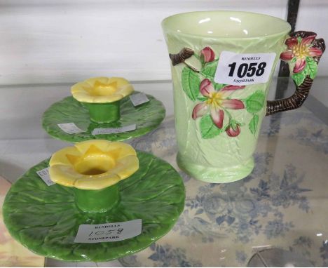 A pair of Wedgwood &amp; Co. flower pattern candlesticks and a Carltonware mug