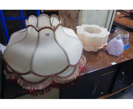 A vintage stitched vellum style standard lamp shade, Art Deco style centre light shade and two others