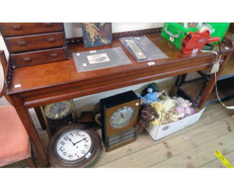 A 4' 6 1/2" reproduction mahogany console table with decorative pierced gallery and panelled sides, set on square tapered leg