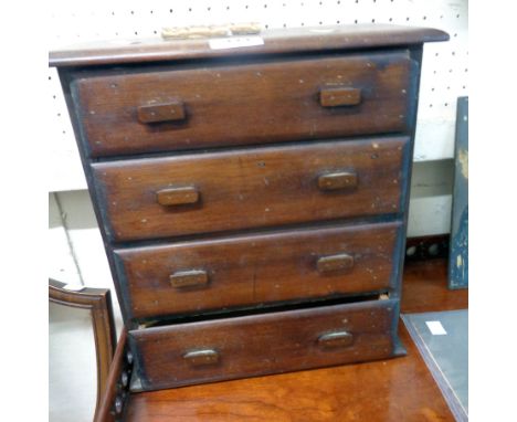 A 12 1/4" vintage stained pine chest with flight of four long graduated drawers, the top one with partitioned interior