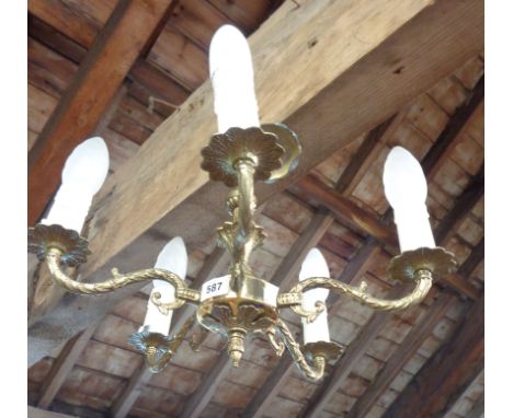 A brass five branch chandelier