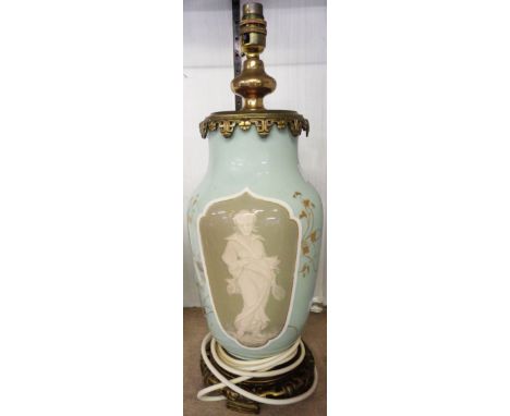 A Limoges style pottery table lamp with opposing pate-sur-pate decorated panels depicting a geisha and prunus, one panel sign