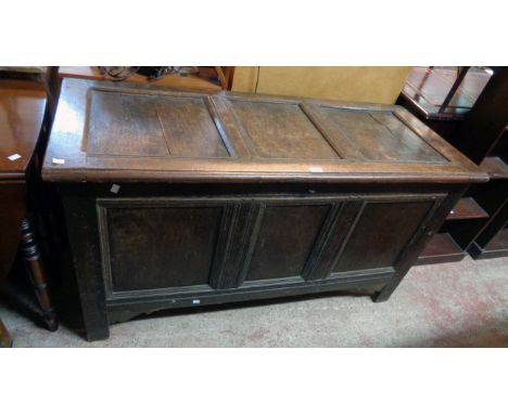 A 4' 5" late 18th Century oak three panel coffer, set on raised bracket front legs - splits to top
