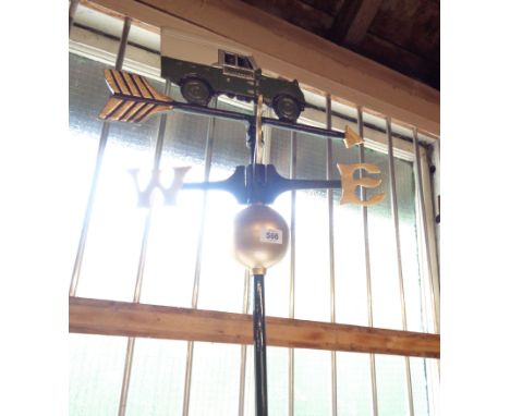 A modern reproduction painted metal Landrover pattern weather vane