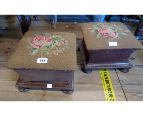 A pair of 10 1/2" Victorian mahogany footstools with rose tapestry decorated tops and waisted sides, set on squat bun feet