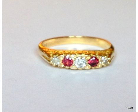 An antique 18ct gold diamond and ruby ring, size M