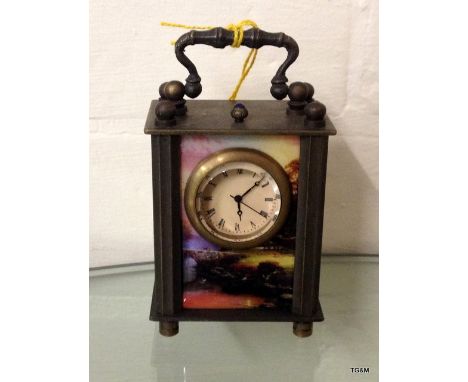A decorative miniature carriage clock