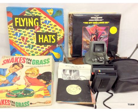 A collection of records, games, Poloroid camera and movie Cine editor