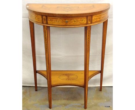An inlaid demi-lune table with tapered legs 1 drawer and low shelf in the Sheridan style 75 x 61 x 32