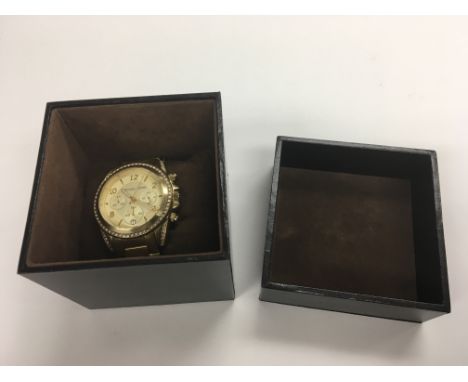 A boxed Michael Kors ladies chronograph watch.