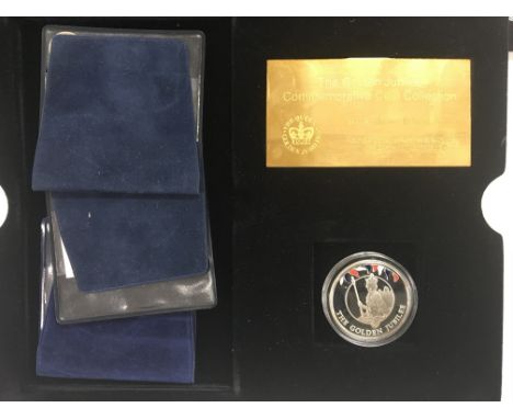 A cased set of 13 silver and enamel commemorative coins.