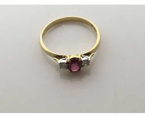An 18ct gold ruby and diamond ring