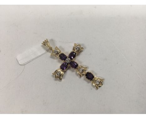 A 14ct yellow gold amethyst and diamond set cross. Weight approx 5.8g
