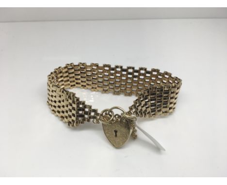 A 9ct gold brick gilt gate bracelet. Weight approx 28.24g