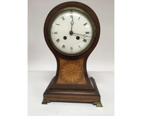 An Edwardian mahogany inlaid mantal clock the enamel dial with Roman numerals