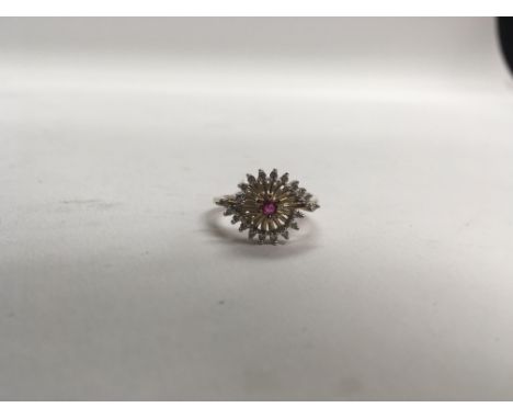 An unusual style ruby and diamond ring. Weight approx 3.3g, size approx N.