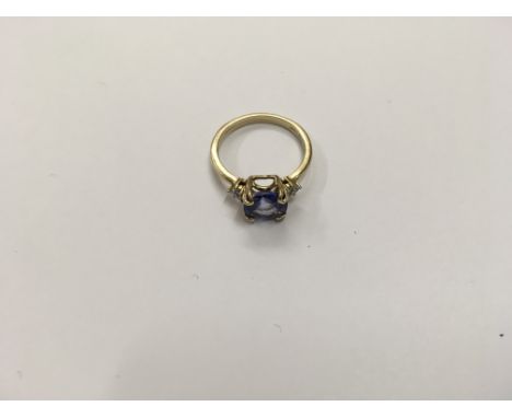 A 9ct gold Tanzanite ring. Size approx O Height approx 3g