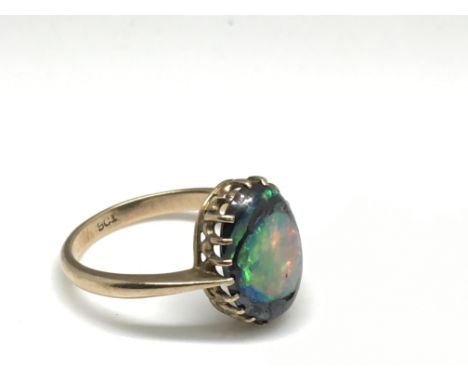 A 9ct gold ring set with a single opal