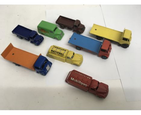 A small collection of unboxed Dinky Toys including Fiat bed lorries.