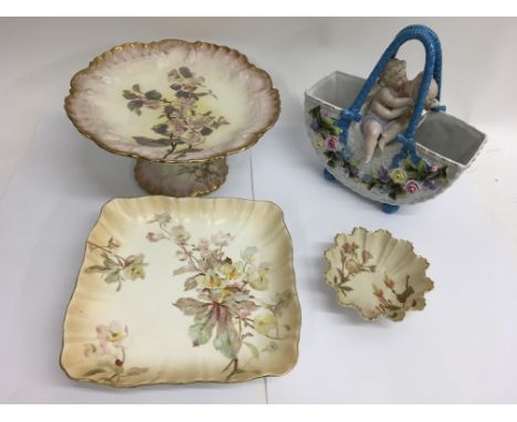 A Royal Worcester blush ivory scalloped dish, two similarly decorated Doulton comports and a cherub basket