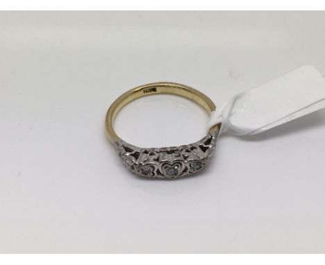 An 18ct gold three stone diamond ring, approx size O and approx 3g.